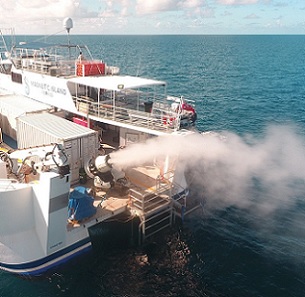 During a field trial, a turbine generates plumes of seawater droplets that rise into the sky. Credit: Brendan Kelaher/SCU