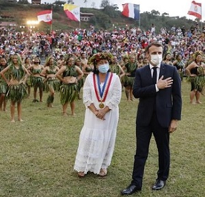 France's President Emmanuel Macron (R) and Hiva Oa Mayor Joëlle Frebault (in white) attend a welcoming ceremony during his visit to Atuona on Hiva Oa, the second largest island of the Marquesas Islands, French Polynesia on July 25, 2021. Photo: Ludovic MARIN / AFP