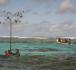 Customary fishing-rights holders from Totoya Island, Fiji, marking a sacred reef area as a no-fishing zone.Credit: Keith Ellenbogen