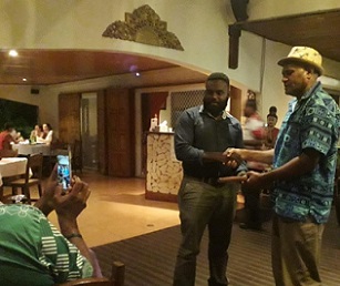 PEBACC Consultant Manager, Bani Arudovo (r) handing over the tokens of appreciation and support to Director of Climate Change and Disaster Risk Reduction, Mr. Mike Waiwai (l)