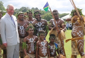 Prince Charles takes a photo with Pele Dancers of Temotu province at Lawson Tama. Photo: Carlos Aruafu