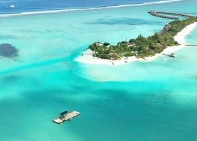 In the lower left corner of this photograph, researchers prepare a submersible device. “Together with our collaborators in the Maldives, we are designing, testing, building, and deploying submersible devices that, based simply on their geometry in relationship to the ocean waves and currents, promote sand accumulation in specific areas,” says associate professor Skylar Tibbits. Credit: Massachusetts Institute of Technology