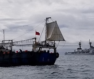 The crew of the Coast Guard Cutter Douglas Munro conducts a boarding of a Chinese fishing vessel. Credit - USCG