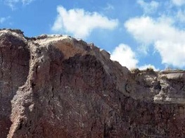 URI graduate student Reilly Hayes (left) and undergraduate Amanda Bednarick examine an outcrop for fossils at Petrified Forest National Park as part of their research. Credit: Amanda Bednarick
