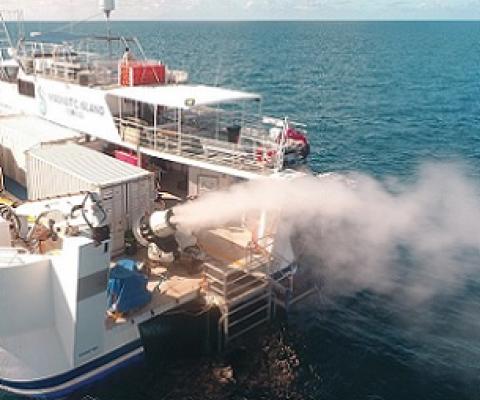 During a field trial, a turbine generates plumes of seawater droplets that rise into the sky. Credit: Brendan Kelaher/SCU