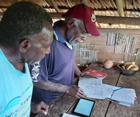 Noel Kaibaba and Philip Vanuau of Bamboo Bay, Malekula entering turtle nest data into Kobo Toolbox, an online smart-phone data collection App, as part of the By-catch and Integrated Ecosystem Management (BIEM) Initiative in Vanuatu. Image: Christopher Bartlett, Resilience