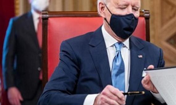 President Biden signing exective orders. Source - www.rnz.co.nz