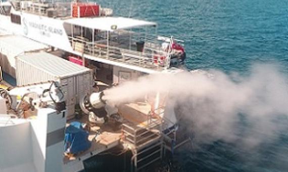 During a field trial, a turbine generates plumes of seawater droplets that rise into the sky. Credit: Brendan Kelaher/SCU