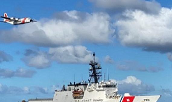 The crews of the Coast Guard Cutter Kimball (WMSL 756) and an Air Station Barbers Point HC-130 Hercules airplane conduct joint operations in the Pacific August 14, 2020. The crews were participating in the multi-country maritime Operation Nasse designed to prevent Illegal, unregulated or unreported (IUU) fishing in Oceania. Credit - U.S. Coast Guard