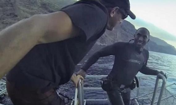 Kobe Bryant and Martin Graf in September of 2013. Bryant had to wear a pair of his Nikes to dive with the sharks.(Courtesy Sharkdiver.com) 