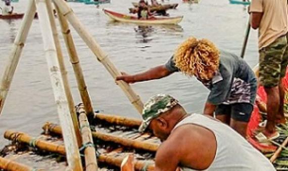 Malaita Provincial Ward Member Preston Billy (front) works with local fishers to prepare the local FAD for its first harvest on 14 December 2020. Credit - Victor Suraniu.