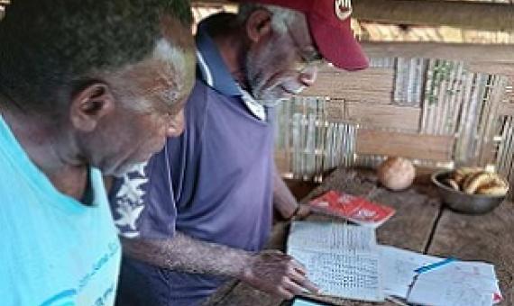 Noel Kaibaba and Philip Vanuau of Bamboo Bay, Malekula entering turtle nest data into Kobo Toolbox, an online smart-phone data collection App, as part of the By-catch and Integrated Ecosystem Management (BIEM) Initiative in Vanuatu. Image: Christopher Bartlett, Resilience