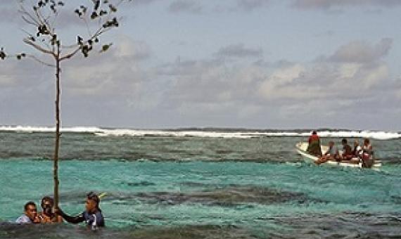 Customary fishing-rights holders from Totoya Island, Fiji, marking a sacred reef area as a no-fishing zone.Credit: Keith Ellenbogen