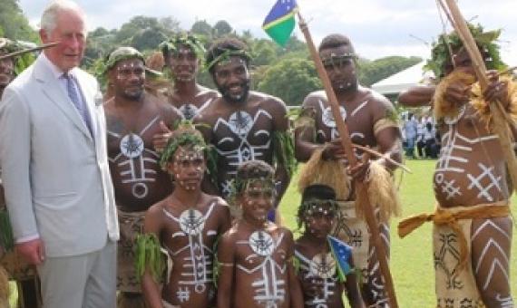 Prince Charles takes a photo with Pele Dancers of Temotu province at Lawson Tama. Photo: Carlos Aruafu