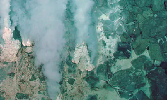 Minerals and carbon dioxide escape from the Earth’s crust into an ocean at this deep-sea vent. NOAA