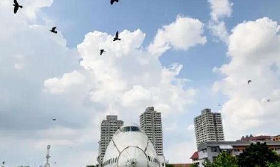Birds fly over abandoned aircraft in the suburbs of Bangkok in October. Photograph: Mladen Antonov/AFP via Getty Images