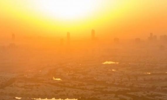 sun sets over a city. source - SHUTTERSTOCK.COM