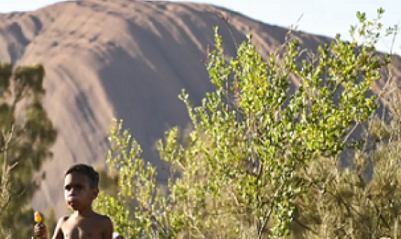 The Anangu community of Mutitjulu stands in stark contrast to the sleek tourism infrastructure in the neighbouring town of Yulara. Lukas Coch/AAP