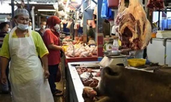A poultry butcher at a wet market in Kuala Lumpur. Photograph: Vincent Thian/AP
